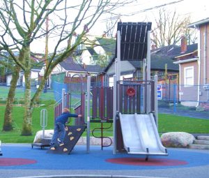 compact, nature-inspired preschool playground structure featuring wood-look elements