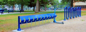 blue scooter chained up at a Blue Imp scooter rack at a park in Alberta, Canada