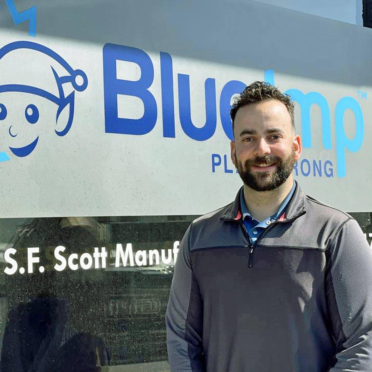 Zach Zubrecki, playground consultant at Blue Imp, specializing in playground equipment Saskatchewan, standing outdoors with a friendly smile, representing expert support for commercial playground equipment projects.